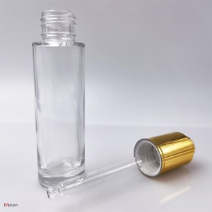 Clear glass bottle with push button dropper UV coating