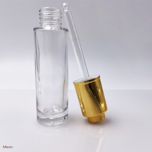 Clear glass bottle with push button dropper UV coating